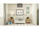 A bright Bedroom with a crib, modern lighting, and minimalist decor at 8323 E Petunia Ave, Mesa, AZ 85212