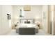 This bedroom features neutral-colored furniture, bright natural light, and modern decor at 8323 E Petunia Ave, Mesa, AZ 85212