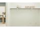 This walk-in closet offers ample storage with shelving and hanging racks and a view of another room at 8323 E Petunia Ave, Mesa, AZ 85212