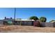 Exterior view of a home featuring a chain-link fence and desert landscaping at 8527 W Jefferson St, Peoria, AZ 85345