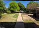 Backyard with trees and pathway at 8527 W Jefferson St, Peoria, AZ 85345