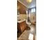 A cozy bathroom features a single vanity, toilet, and tiled flooring at 8527 W Jefferson St, Peoria, AZ 85345