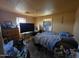 Bedroom view with natural light, window air conditioner and basic furniture at 8527 W Jefferson St, Peoria, AZ 85345