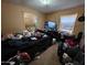Features a basic bedroom with a bed, television, a window air conditioner and basic furniture at 8527 W Jefferson St, Peoria, AZ 85345