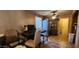 Features a dining area with tile flooring, a table, and a view into the kitchen area with modern appliances at 8527 W Jefferson St, Peoria, AZ 85345