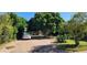Spacious driveway with mature trees providing ample shade and parking at 8527 W Jefferson St, Peoria, AZ 85345