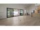 Open concept living room and dining area with large sliding glass doors overlooking the backyard and pool at 8648 E San Jacinto Dr, Scottsdale, AZ 85258