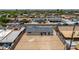 Back of a single-story home featuring a large, empty backyard space at 927 E Greenway Rd, Phoenix, AZ 85042