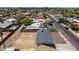Back of a single-story home with an empty backyard space in a residential area at 927 E Greenway Rd, Phoenix, AZ 85042