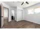 Cozy bedroom provides wood flooring and easy access to an attached bathroom at 927 E Greenway Rd, Phoenix, AZ 85042