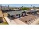 Single-story home with a covered carport and low-maintenance desert landscaping at 927 E Greenway Rd, Phoenix, AZ 85042