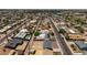 An aerial view of the neighborhood featuring homes, streets, and mature trees at 927 E Greenway Rd, Phoenix, AZ 85042