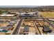 A neighborhood shot of homes on a sunny day, with a school nearby at 927 E Greenway Rd, Phoenix, AZ 85042