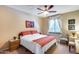 Bedroom with carpet, ceiling fan, and an inviting window view with decorative curtains at 965 E Virgo Pl, Chandler, AZ 85249