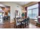 Charming dining room with stylish chandelier, modern decor, and large window for natural light at 965 E Virgo Pl, Chandler, AZ 85249