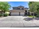 Attractive two-story home featuring a three-car garage, neutral color scheme, and well-maintained landscaping at 965 E Virgo Pl, Chandler, AZ 85249