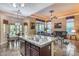 Spacious kitchen island offers an eat-in area open to the living room and dining with backyard views at 965 E Virgo Pl, Chandler, AZ 85249