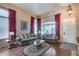 Cozy living room with hardwood floors, ample natural light, and comfortable seating arrangement at 965 E Virgo Pl, Chandler, AZ 85249