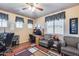 Office space with wood floors, ceiling fan, multiple windows, and plenty of workspace at 965 E Virgo Pl, Chandler, AZ 85249