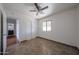 Bedroom featuring neutral tile floors and a window overlooking the yard at 10002 N 66Th Ln, Glendale, AZ 85302