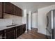 A recently updated kitchen with plenty of cabinet space, light countertops, and stainless-steel appliances at 10002 N 66Th Ln, Glendale, AZ 85302