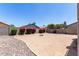 Spacious backyard area featuring desert landscaping and a brick perimeter, perfect for outdoor enjoyment at 12426 W Adams St, Avondale, AZ 85323