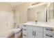 Bathroom featuring a tub and shower combo with updated vanity at 12426 W Adams St, Avondale, AZ 85323