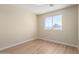 Comfortable bedroom featuring a large window with outdoor views at 12426 W Adams St, Avondale, AZ 85323