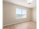 Sunny bedroom with a large window offering bright natural light at 12426 W Adams St, Avondale, AZ 85323