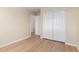 Bedroom with light colored flooring and sliding closet doors at 12426 W Adams St, Avondale, AZ 85323