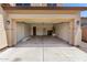 Spacious open garage with concrete floor and interior door visible in the background at 12426 W Adams St, Avondale, AZ 85323