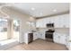 Modern kitchen with stainless steel appliances, white cabinetry and a view of the backyard at 12426 W Adams St, Avondale, AZ 85323