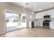 Bright kitchen with stainless steel appliances, white cabinets and a view to the backyard at 12426 W Adams St, Avondale, AZ 85323