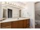 Bathroom showcasing a vanity, ample lighting and a toilet and shower in the background at 1258 E Granada St, Mesa, AZ 85203