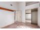 Bright bedroom with high ceilings, mirrored closet doors, and neutral carpet at 1258 E Granada St, Mesa, AZ 85203