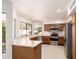 Open kitchen featuring stainless appliances, white countertops, wood cabinets and natural light from the multiple windows at 1258 E Granada St, Mesa, AZ 85203