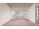 Bright and airy living room featuring large windows and a light color scheme at 1258 E Granada St, Mesa, AZ 85203