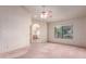 Bright main bedroom includes an archway to the main bath, ceiling fan, and a window that offers an abundance of light at 1258 E Granada St, Mesa, AZ 85203