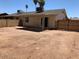 Large backyard with block fence and a covered patio, perfect for outdoor entertaining at 13208 N 51St Ln, Glendale, AZ 85304