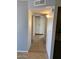 Hallway featuring tile flooring, neutral-colored walls, and a recessed light fixture at 13208 N 51St Ln, Glendale, AZ 85304