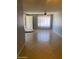 Comfortable living room featuring tile flooring, light-colored walls, and a window for natural light at 13208 N 51St Ln, Glendale, AZ 85304