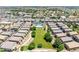 Extensive aerial view of community, showcasing common green areas and the community pool at 1350 S Greenfield Rd # 2205, Mesa, AZ 85206