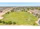 A sprawling green field surrounded by a residential area with distant mountain views at 1350 S Greenfield Rd # 2205, Mesa, AZ 85206