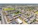 Expansive aerial view of a Primary-planned community featuring lush green spaces and a sparkling blue community pool at 1350 S Greenfield Rd # 2205, Mesa, AZ 85206