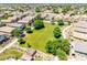 Aerial view showcases a large, green common area surrounded by attractive homes, perfect for outdoor activities at 1350 S Greenfield Rd # 2205, Mesa, AZ 85206