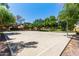 Community basketball court features a well-maintained court and backdrop of trees at 1350 S Greenfield Rd # 2205, Mesa, AZ 85206
