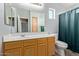 Bathroom featuring a wood vanity, a large mirror, and a toilet at 1350 S Greenfield Rd # 2205, Mesa, AZ 85206