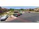 Well-maintained community pool area with ample parking and manicured landscaping at 1350 S Greenfield Rd # 2205, Mesa, AZ 85206