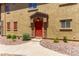 Exterior view of the front door and a view of the manicured landscaping at 1350 S Greenfield Rd # 2205, Mesa, AZ 85206