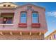 A lovely exterior shot featuring a view of the home's front window boxes and balcony at 1350 S Greenfield Rd # 2205, Mesa, AZ 85206